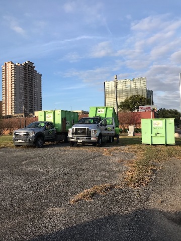 houston dumpster rental containers in parking lot 